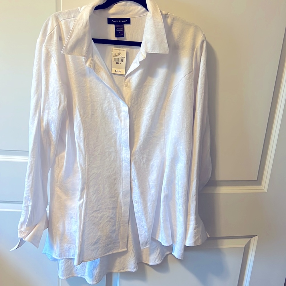 Woman’s white long sleeve blouse